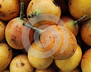 Sweet granadilla, exotic, tropical Passiflora ligularis produce fruit