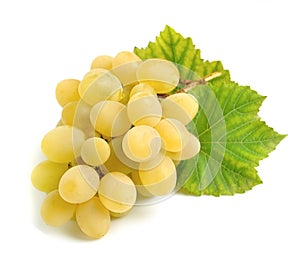 Sweet grapes with leaves.