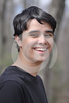 Sweet and Handsome high-school boy smiling to the camera