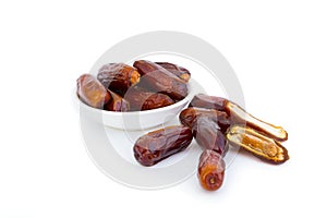 Sweet and healthy dates isolated on white background.