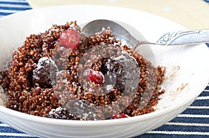 Healthy dessert from boiled quinoa with dried fruit.