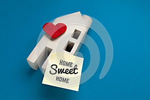 Sweet home concept. Concrete house with a heart, buying or insuring real estate