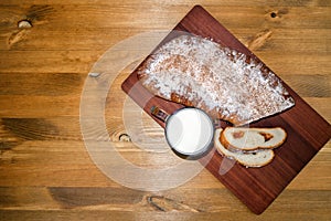 Sweet homemade bakes and a glass of fresh milk, top view