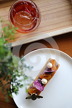 Sweet homemade fance peach cake on wooden table