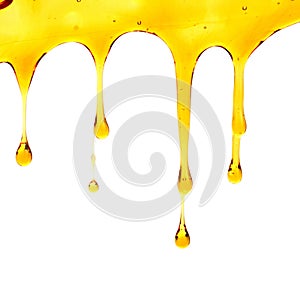 Sweet honeycomb and wooden dipper with dripping honey isolated on white background.