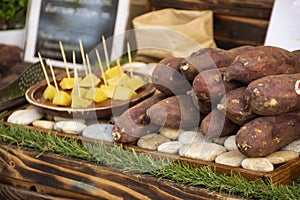 Sweet japanese potato roasted and grilled for sale thai people and travelers foreigner at street market in Nakhon Ratchasima,