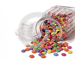 Sweet jar with sweets spilling out