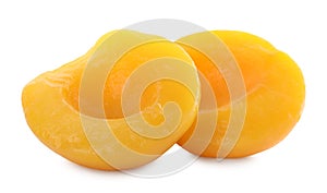 Sweet juicy canned peach halves isolated on white