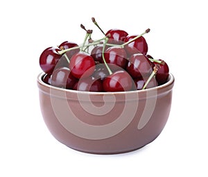 Sweet juicy cherries in bowl isolated