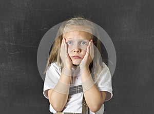 Sweet junior schoolgirl crying sad in children education stress and bullying victim