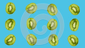 Sweet kiwis is shaking on a colored background. Vegetarian theme