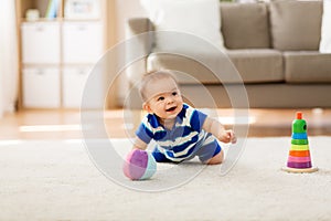 Sweet little asian baby boy with toys at home