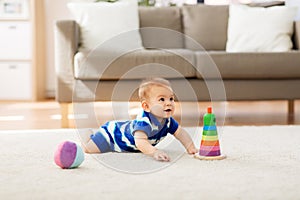 Sweet little asian baby boy with toys at home