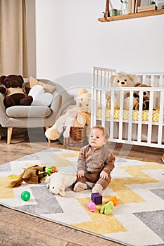 sweet little boy sitting on floor