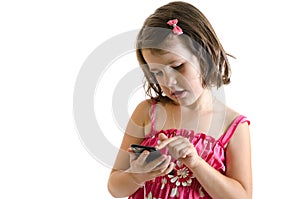 Sweet little girl play on smartphone concetrated isolated