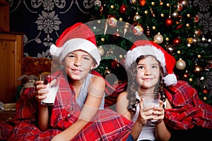 Sweet little kids drinking milk