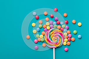 Sweet lollipop and colorful chocolate candy pills