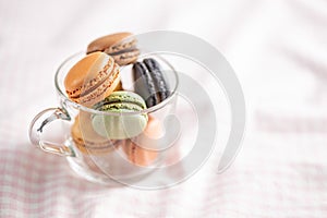 Sweet macaron dessert. Colorful macarons in cup