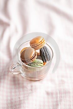 Sweet macaron dessert. Colorful macarons in cup