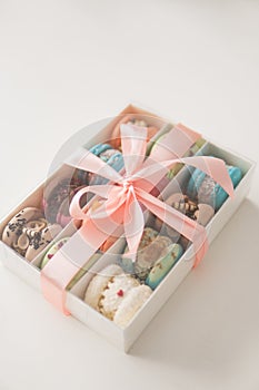 Sweet macaroons macarons. Macaroons in box. French macaroon cake. Macarons or macaroons, cookies