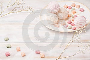 Sweet marshmallow zephyr caramel sweets tea wooden background