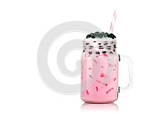 Sweet milk tea with bubbles in clear glass and drinking straws on pink background. Thai milk with black pearls.  Clipping path