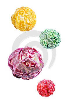 Sweet multicolor popcorn on a white isolated background