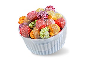 Sweet multicolor popcorn on a white isolated background