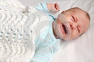 Sweet Newborn Baby Crying in Crib