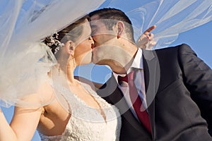 Sweet Newly Married Couple Kissing Outdoor photo