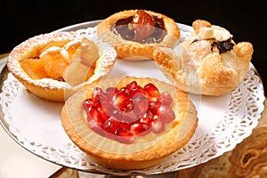 Sweet pastries with fruits and jams in buffet at the bar