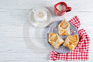 Sweet pastries in the shape of an envelope with heart filled with apples, dessert for Valentine`s Day or Mother`s day, top view