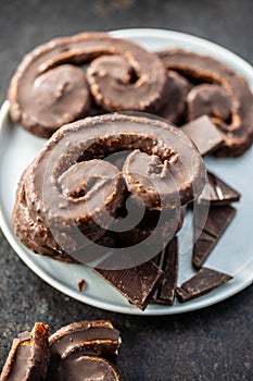 Sweet pastry palmeritas with chocolate icing photo