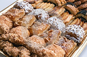 Sweet pastry, puff pastry with powdered sugar, with pine nuts, with jam made from Siam pumpkin,