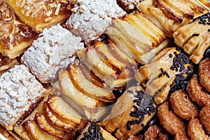 Sweet pastry, puff pastry with powdered sugar, with pine nuts, with jam made from Siam pumpkin, photo