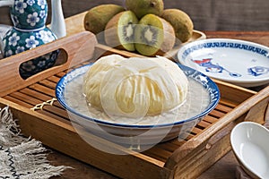 Sweet peanut soup with brown sugar bun cake in a bowl