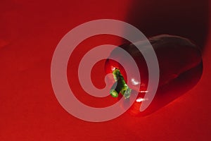 SWEET PEPPER ON A RED BACKGROUND. photo for the menu, proper nutrition. fresh vegetables