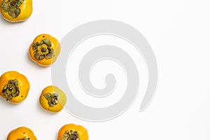 Sweet persimmon fruit on white background