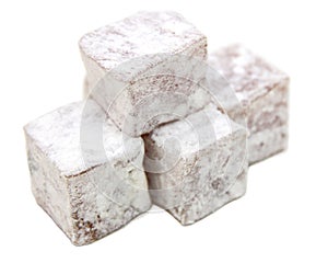 Sweet pieces of Turkish delight isolated on white background