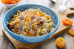 Sweet pilaf with raisins and dried apricots