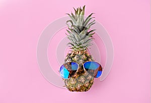 Sweet pineapple in sunglasses and headphones