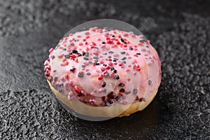 Sweet pink Donut with chocolate, raspberry and strawberry chippings