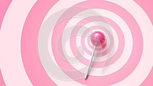 Sweet pink lollipop on stick on pink circles background