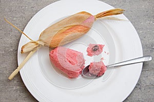 Sweet pink Mexican tamales filed corn dough, food in Mexico photo