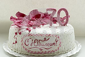 Sweet pink orchids white anniversary cake closeup