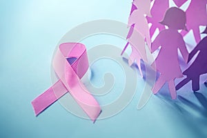 Sweet pink ribbon shape with the girl paper doll on blue background for Breast Cancer Awareness symbol to promote in october mo