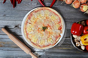 Sweet pizza with a chicken and pineapples