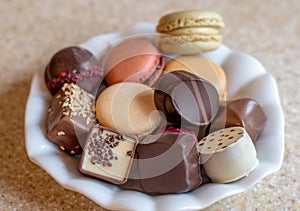 Sweet plate with candy and macarons