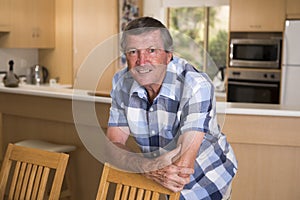 Sweet portrait of senior mature middle age man around 70 years old posing happy smiling looking at camera in healthy aging and ret