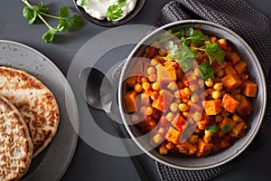 Sweet potato and chickpea curry with naan bread